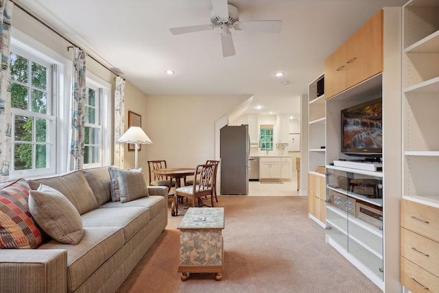 living room featuring recessed lighting, light colored carpet, and ceiling fan