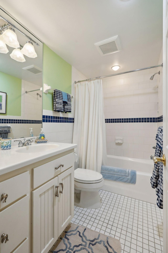 2670 Woolsey Ln, Woodland, MN 55391 - bathroom featuring tile walls, vanity, shower / bath combination with curtain, and tile patterned flooring