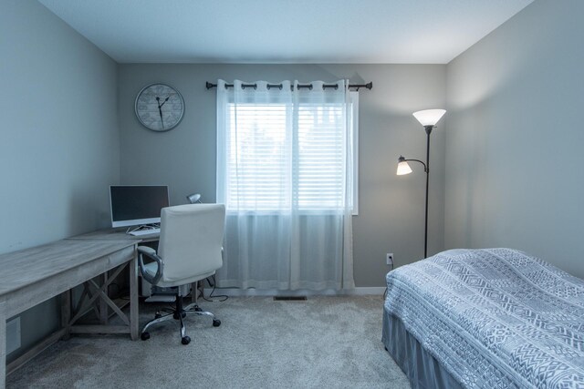 bedroom with light colored carpet