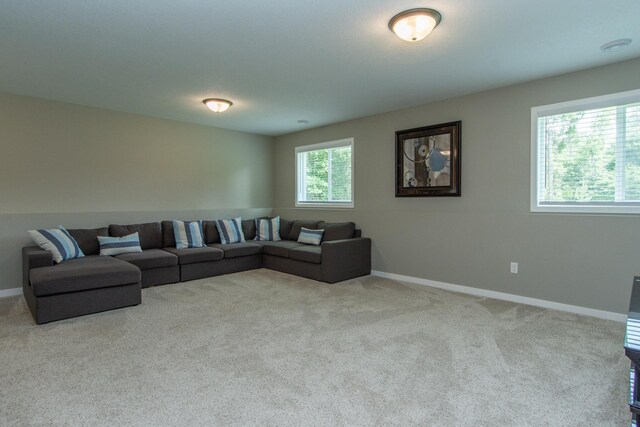 carpeted living room featuring plenty of natural light