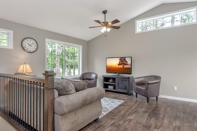 living room featuring vaulted ceiling, dark hardwood / wood-style floors, ceiling fan, and a wealth of natural light