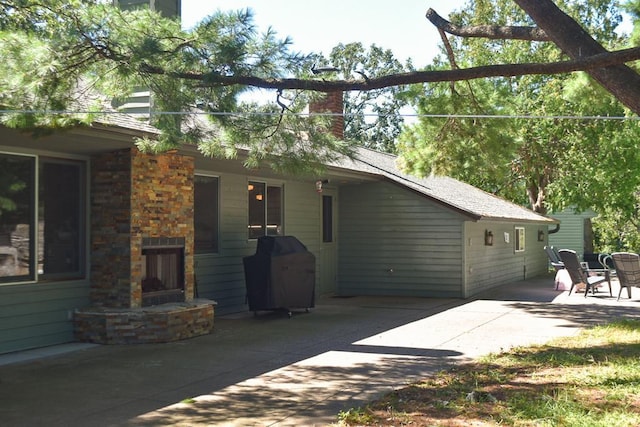 rear view of property featuring a patio area