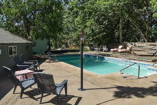 view of pool featuring a patio