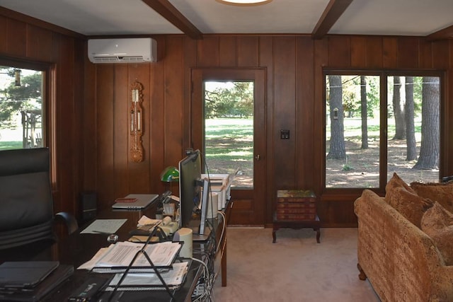 office with a wealth of natural light, carpet flooring, beam ceiling, and a wall mounted air conditioner