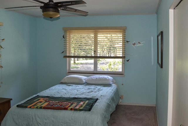 bedroom featuring ceiling fan and carpet floors