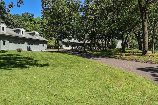 view of yard featuring a garage