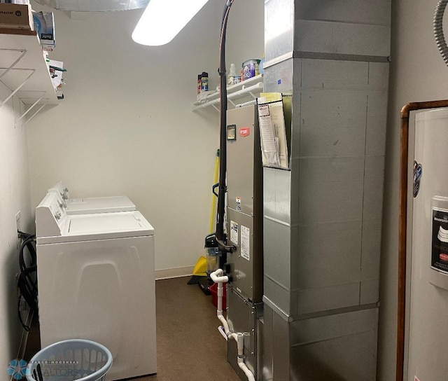 clothes washing area featuring carpet floors and separate washer and dryer