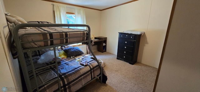 bedroom with ornamental molding, a textured ceiling, and carpet flooring