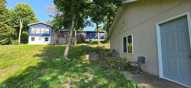 view of yard featuring a wooden deck