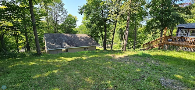 view of yard featuring a wooden deck