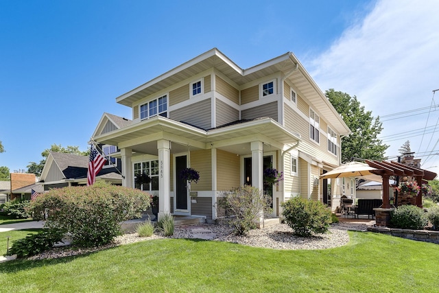 view of front of property with a front yard and a porch