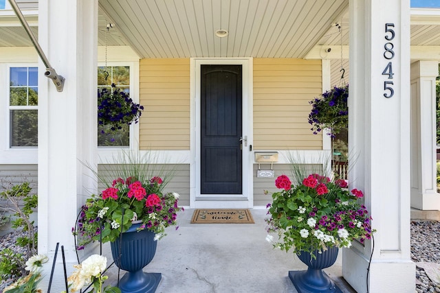 doorway to property featuring a porch