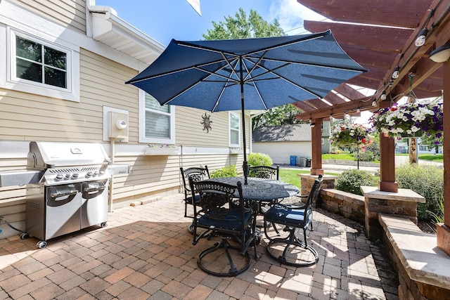 view of patio / terrace featuring outdoor dining area, a grill, and a pergola