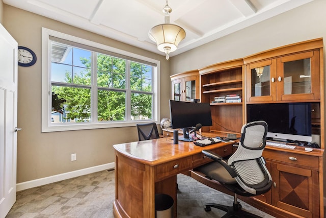 office area with light floors, coffered ceiling, and baseboards