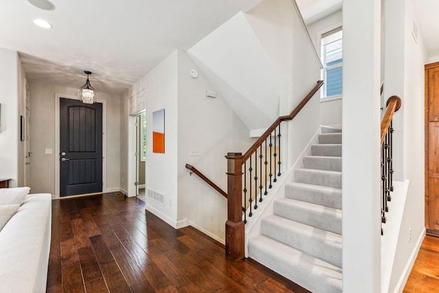 entryway with recessed lighting, visible vents, baseboards, stairs, and hardwood / wood-style floors