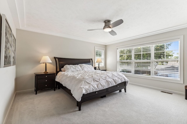 bedroom featuring baseboards, visible vents, ceiling fan, a textured ceiling, and carpet floors