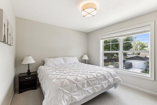 bedroom with baseboards and carpet flooring