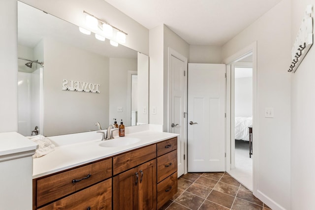 full bathroom featuring tile patterned flooring, a shower, and vanity