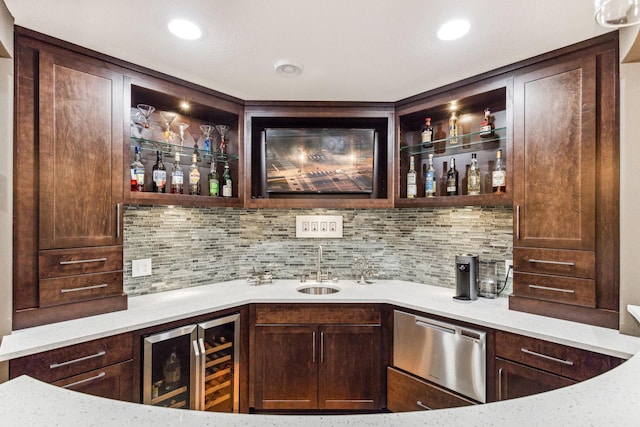 bar featuring beverage cooler, tasteful backsplash, indoor wet bar, and recessed lighting