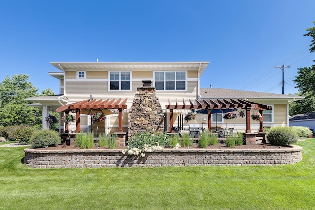 back of property with a patio area, a lawn, and a pergola