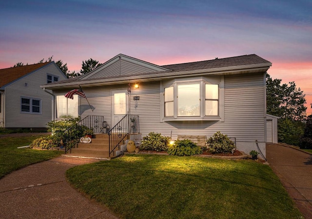 view of front of home featuring a yard