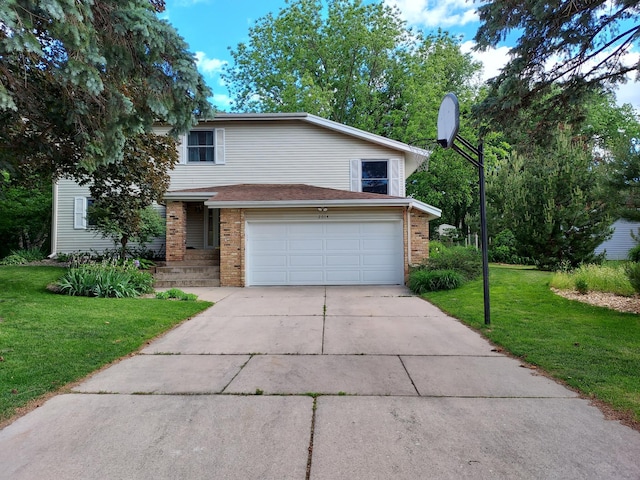 view of front of property with a garage and a front lawn