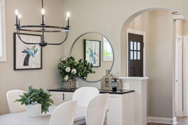 dining space featuring an inviting chandelier