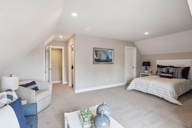 carpeted bedroom featuring vaulted ceiling