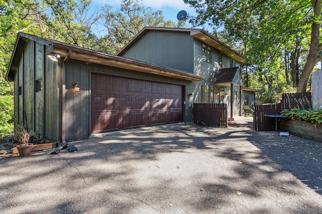 view of property exterior featuring a garage