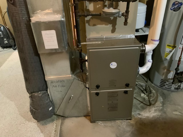 utility room with water heater