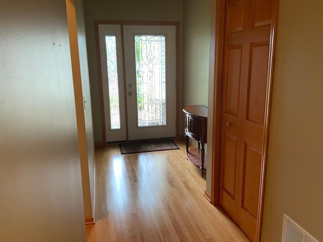 foyer with light wood-type flooring