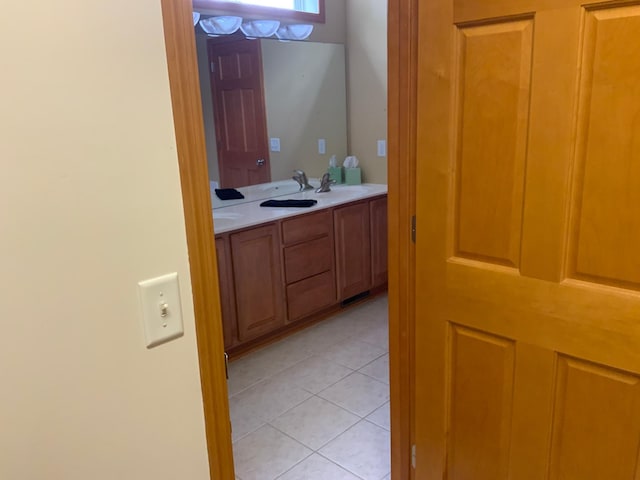 bathroom with vanity and tile patterned floors