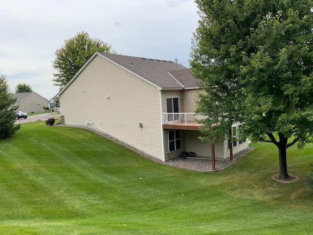 view of property exterior featuring a lawn