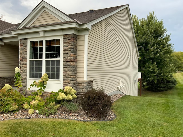 view of home's exterior featuring a yard