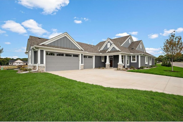 craftsman-style house featuring a front yard and a garage