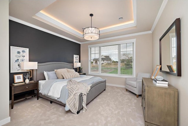 bedroom featuring light carpet, a raised ceiling, and crown molding