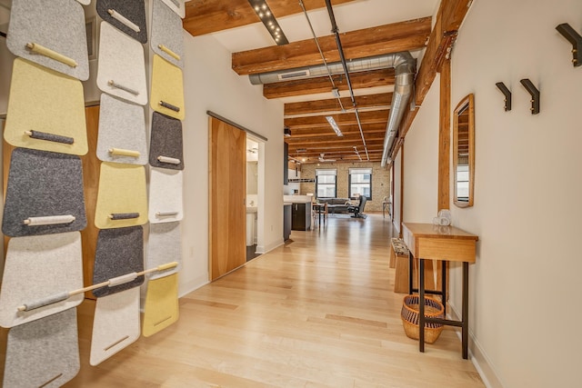 corridor featuring hardwood / wood-style floors and beam ceiling