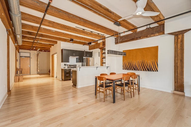 dining area featuring light hardwood / wood-style flooring and ceiling fan