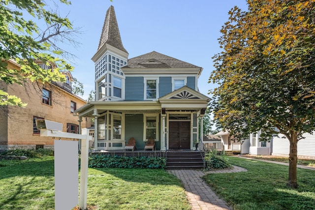 victorian-style house with covered porch and a front yard