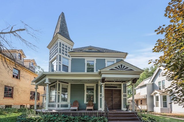 victorian-style house featuring covered porch