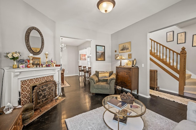 living room featuring radiator and dark hardwood / wood-style flooring