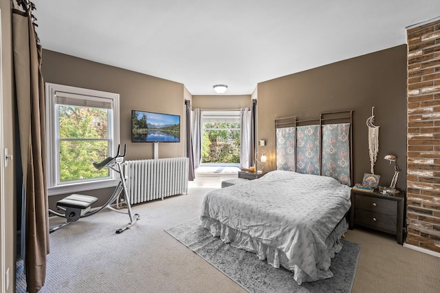 bedroom featuring radiator heating unit and light colored carpet