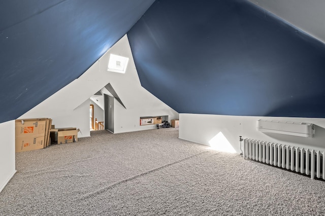 bonus room featuring carpet flooring, vaulted ceiling, and radiator heating unit