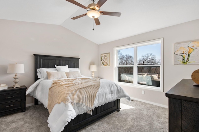 carpeted bedroom with ceiling fan and lofted ceiling