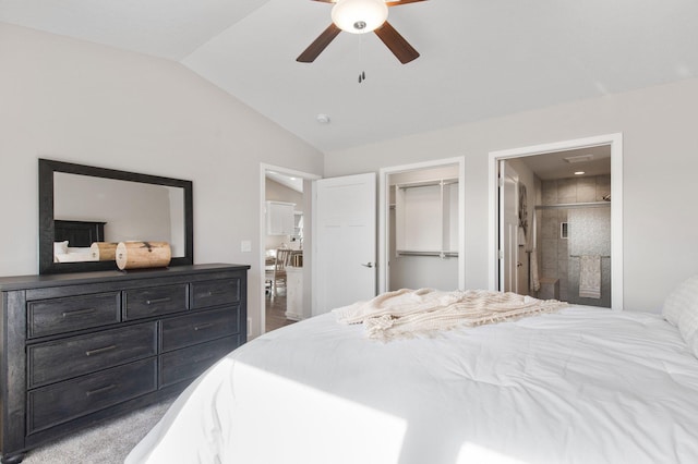 bedroom with lofted ceiling, carpet floors, a spacious closet, ceiling fan, and a closet