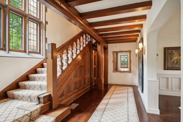 interior space featuring beamed ceiling and hardwood / wood-style flooring