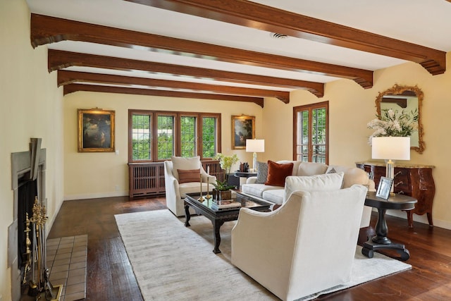 living room featuring radiator heating unit, beam ceiling, a healthy amount of sunlight, and dark hardwood / wood-style flooring