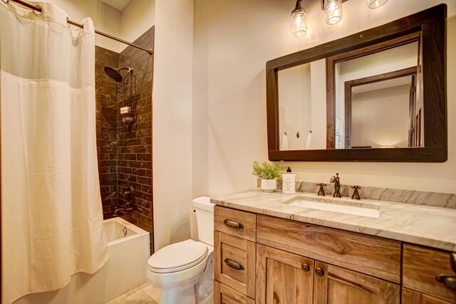 full bathroom featuring tile patterned flooring, vanity, toilet, and shower / bathtub combination with curtain