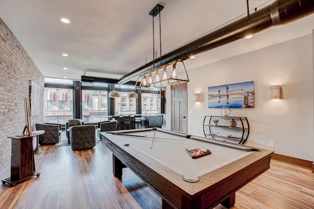 game room featuring billiards and light hardwood / wood-style flooring