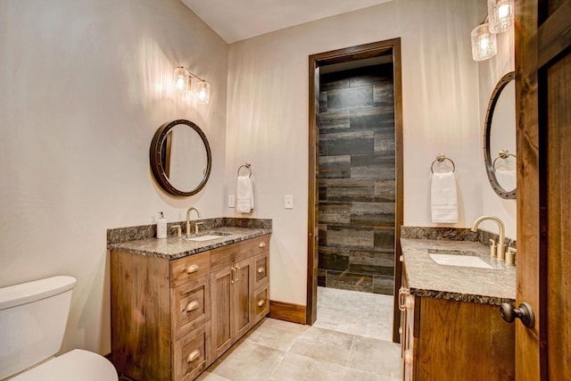 bathroom with tile patterned floors, vanity, and toilet